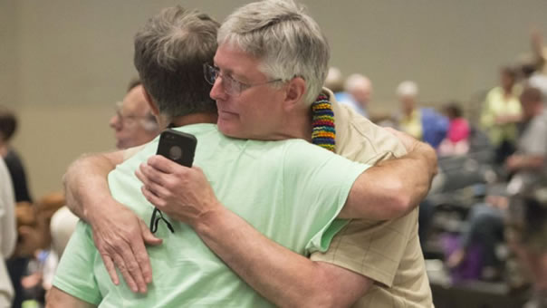 Gary Lyon, left, of Leechburg, Pa., and Bill Samford celebrate approval of Gay marriage by Presbyterian church