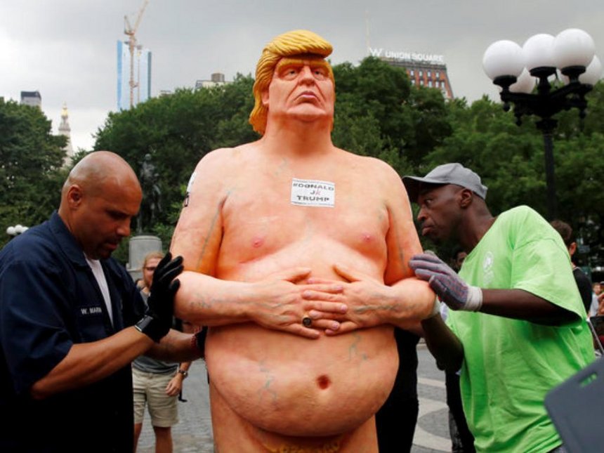 Naked Donald Trump statues draw dozens of onlookers in US cities
