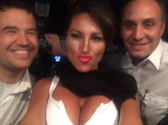 Pilots fired after posing with model