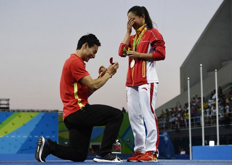 Podium proposal steals show as Shi takes springboard diving gold