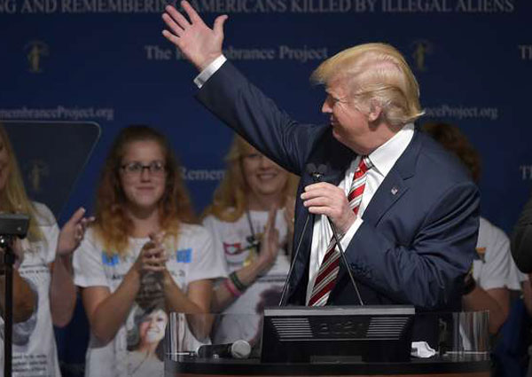 Trump says Clinton too soft on migrants, started ‘birther’ row